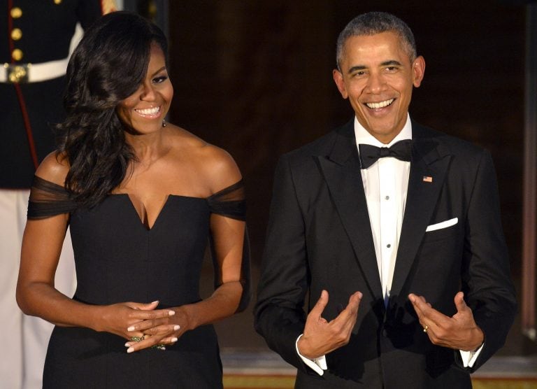 File Photo U.S. President Barack Obama gestures to himself as he and First Lady Michelle Obama await the arrival of Chinese President Xi Jinping and Madame Peng Liyuan, for a State Dinner at the White House, in Washington, September 25, 2015.   REUTERS/Mi