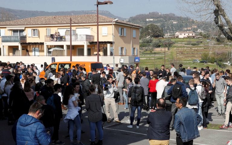 High school students stand near the Tocqueville high school after a shooting incident injuring at least eight people, in Grasse, southern France, March 16, 2017.   REUTERS/Eric Gaillard