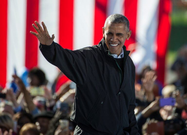 President Barack Obama waves as he walks to the podium to speak at a campaign rally for Democratic presidential candidate Hillary Clinton, Friday, Oct. 14, 2016, at the Cleveland Burke Lakefront Airport in Cleveland, Ohio. (AP Photo/Phil Long)