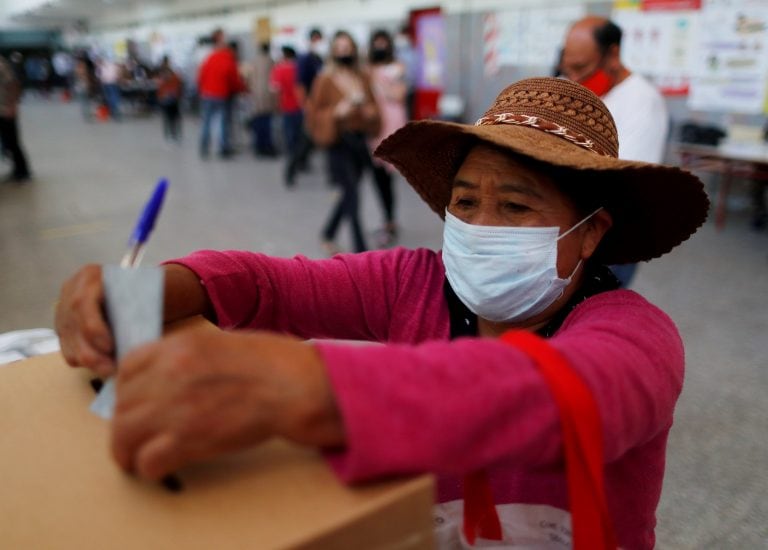 A Bolivian resident living in Argentina casts her vote at a public school in Bolivia's presidential election, as the spread of the coronavirus disease (COVID-19) continues, in Buenos Aires, Argentina October 18, 2020. REUTERS/Agustin Marcarian