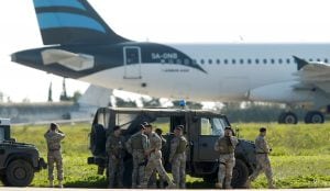 Maltese troops survey a hijacked Libyan Afriqiyah Airways Airbus A320 on the runway at Malta Airport, December 23, 2016. REUTERS/Darrin Zamit-Lupi   MALTA OUT