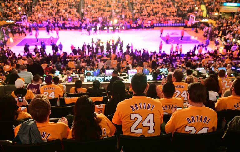 Fans wear Kobe Bryant shirts for the NBA game between the Los Angeles Lakers and the Portland Trailblazers on January 31, 2020 in Los Angeles. (Photo by Frederic J. BROWN / AFP)