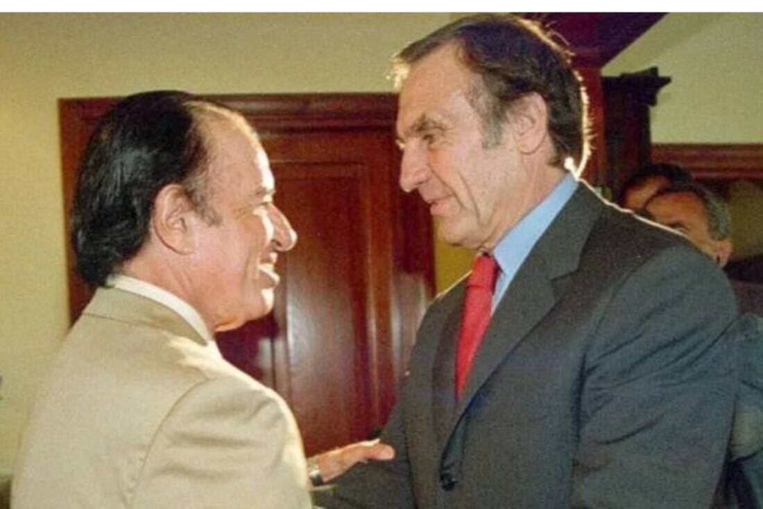 Carlos Reutemann junto a Carlos Menem.