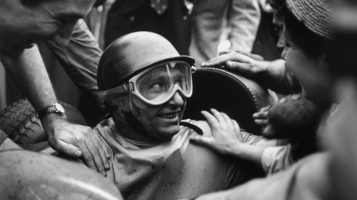 Argentinian racing driver Juan Manuel Fangio (1911 - 1995) wins the British Grand Prix at Silverstone, 14th July 1956. (Photo by George Stroud/Express/Hulton Archive/Getty Images)