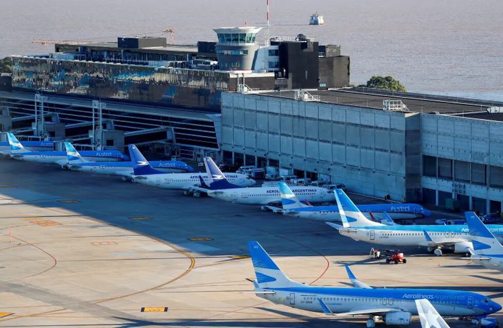 FILE PHOTO: Aerolineas Argentinas' passenger planes are seen parked at Jorge Newbery domestic airport, as the spread of the coronavirus disease (COVID-19) continues, in Buenos Aires, Argentina April 29, 2020. REUTERS/Agustin Marcarian/File Photo