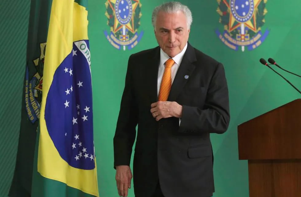 Handout picture released by Agencia Brasil showing Brazilian President Michel Temer after he announced Brazil is sending troops to reinforce security on the border with Venezuela, at Planalto Palace in Brasilia on August 28, 2018. - Temer signed a decree to send the army to \