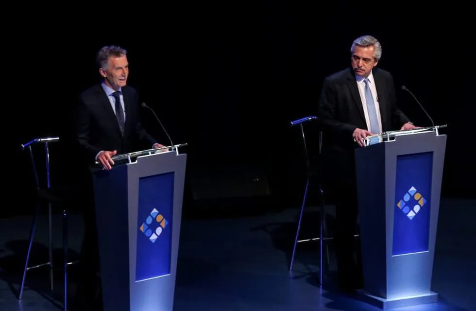 FILE PHOTO: Argentina's President Mauricio Macri and presidential candidate Alberto Fernandez participate in the presidential debate ahead of the October 27 presidential election, at the University of Buenos Aires' Law School, in Buenos Aires, Argentina, October 20, 2019. REUTERS/Agustin Marcarian/File Photo/File Photo