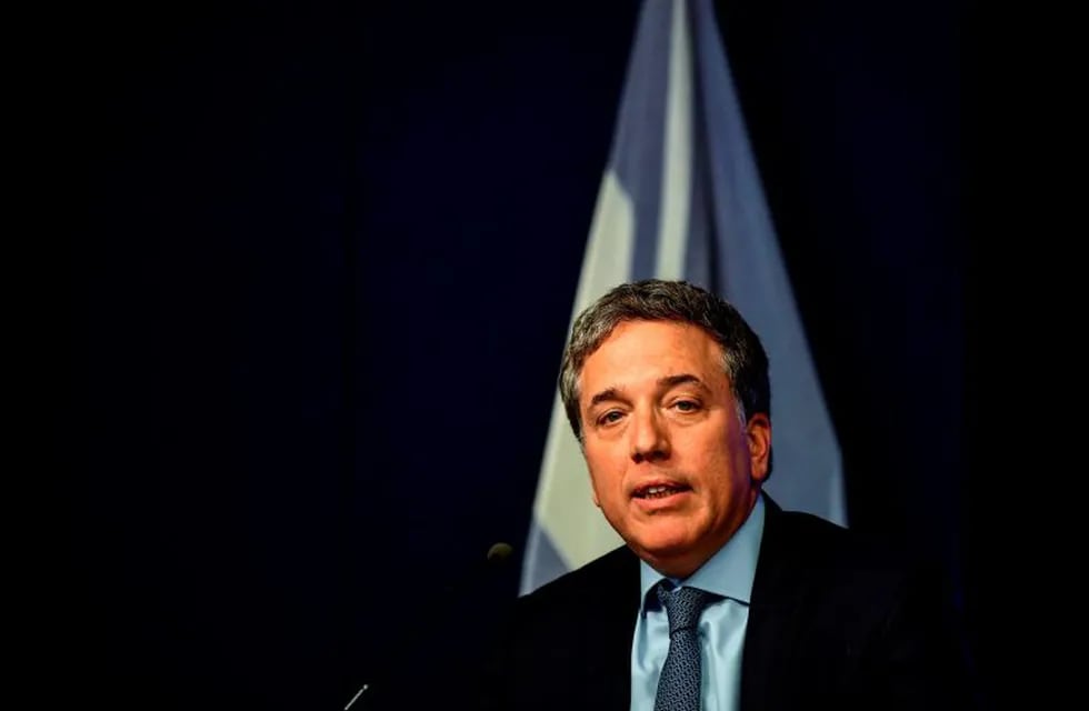Argentina's Finance Minister Nicolas Dujovne speaks during a press conference in Buenos Aires, on January 18, 2018. - Finance Minister Nicolas Dujovne announced Friday that in 2018 Argentina had a fiscal deficit of 2.4% of the Gross Domestic Product (GDP), meeting the goal agreed with the International Monetary Fund (IMF) and ratifying the commitment to achieve the balance in 2019. (Photo by RONALDO SCHEMIDT / AFP) buenos aires NICOLAS DUJOVNE ministro de hacienda anuncio resultados financieros conferencia de prensa