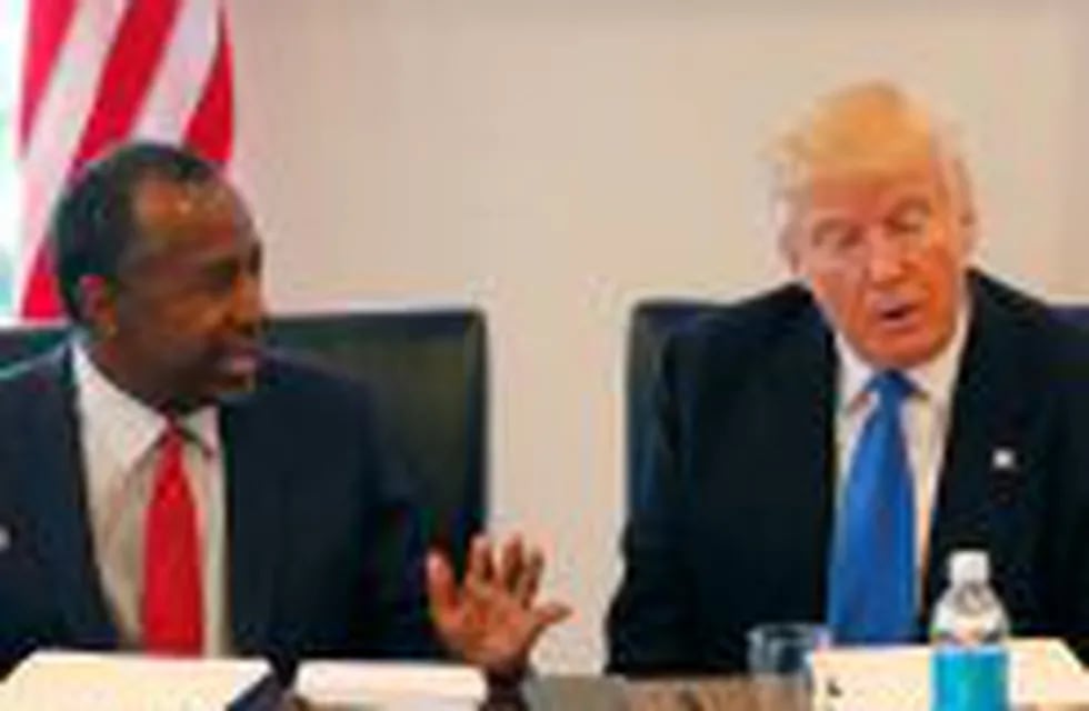 FILE - In this Aug. 25, 2016 photo, former Republican presidential candidate Dr. Ben Carson during Republican presidential candidate Donald Trump's roundtable meeting with the Republican Leadership Initiative in his offices at Trump Tower in New York. Trump has chosen former Campaign 2016 rival Ben Carson to become secretary of the Department of Housing and Urban Development.  (AP Photo/Gerald Herbert)
