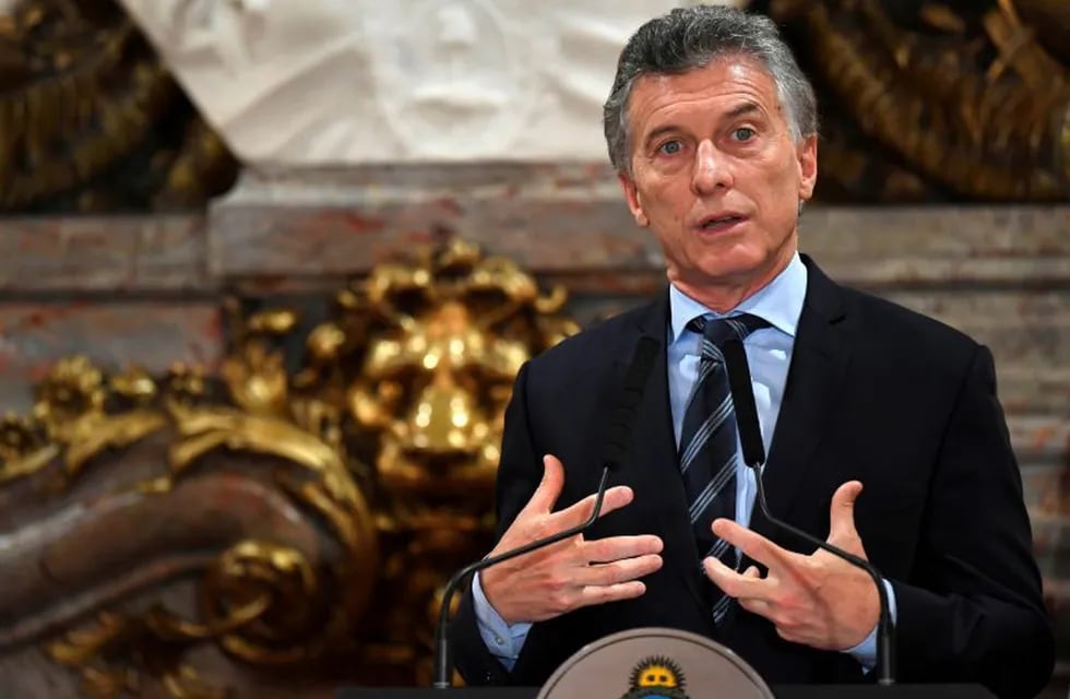 Argentinian President Mauricio Macri addresses the media, next to his Peruvian counterpart Pedro Pablo Kuczynski (out of the frame), at the Casa Rosada presidential palace in Buenos Aires, on November 3, 2017.    \nKuczynski arrived in Argentina to sign a series of bilateral agreements. / AFP PHOTO / EITAN ABRAMOVICH