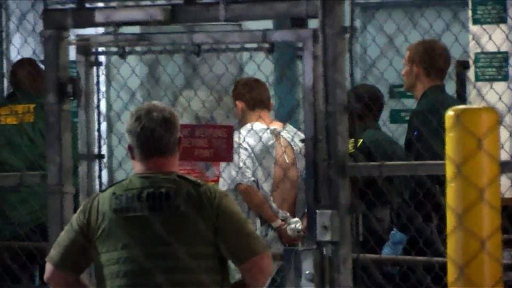 This video screen grab image shows shooting suspect Nikolas Cruz on February 15, 2018 at Broward County Jail in Ft. Lauderdale, Florida.
The heavily armed teenager who gunned down students and adults at a Florida high school was charged Thursday with 17 counts of premeditated murder, court documents showed.
Nikolas Cruz, 19, killed fifteen people in a hail of gunfire at Marjory Stoneman Douglas High School in Parkland, Florida. Two others died of their wounds later in hospital, the sheriff's office said.
 / AFP PHOTO / AFP TV / Miguel GUTTIEREZ