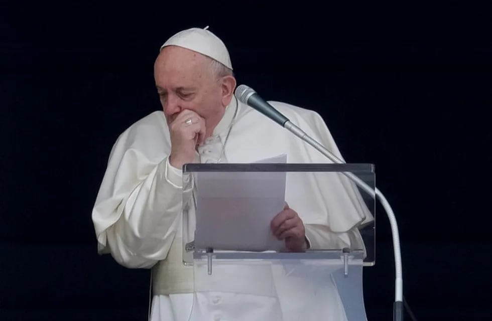 Pope Francis coughs as he recites the Angelus noon prayer from the window of his studio overlooking St. Peter's Square, at the Vatican, Sunday, March 1, 2020. A coughing Pope Francis told pilgrims gathered for the traditional Sunday blessing that he is canceling his participation at a week-long spiritual retreat in the Roman countryside because of a cold. It is the first time in his seven-year papacy that he has missed the spiritual exercises that he initiated early in his pontificate to mark the start of each Lenten season. (AP Photo/Andrew Medichini)