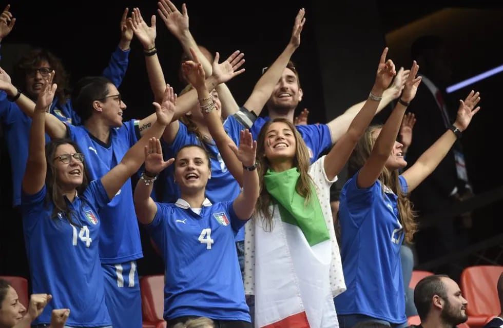 Italian supporters celebrate during the France 2019 Women's World Cup Group C football match between Australia and Italy, on June 9, 2019, at the Hainaut Stadium in Valenciennes, northern France. (Photo by FRANCOIS LO PRESTI / AFP)