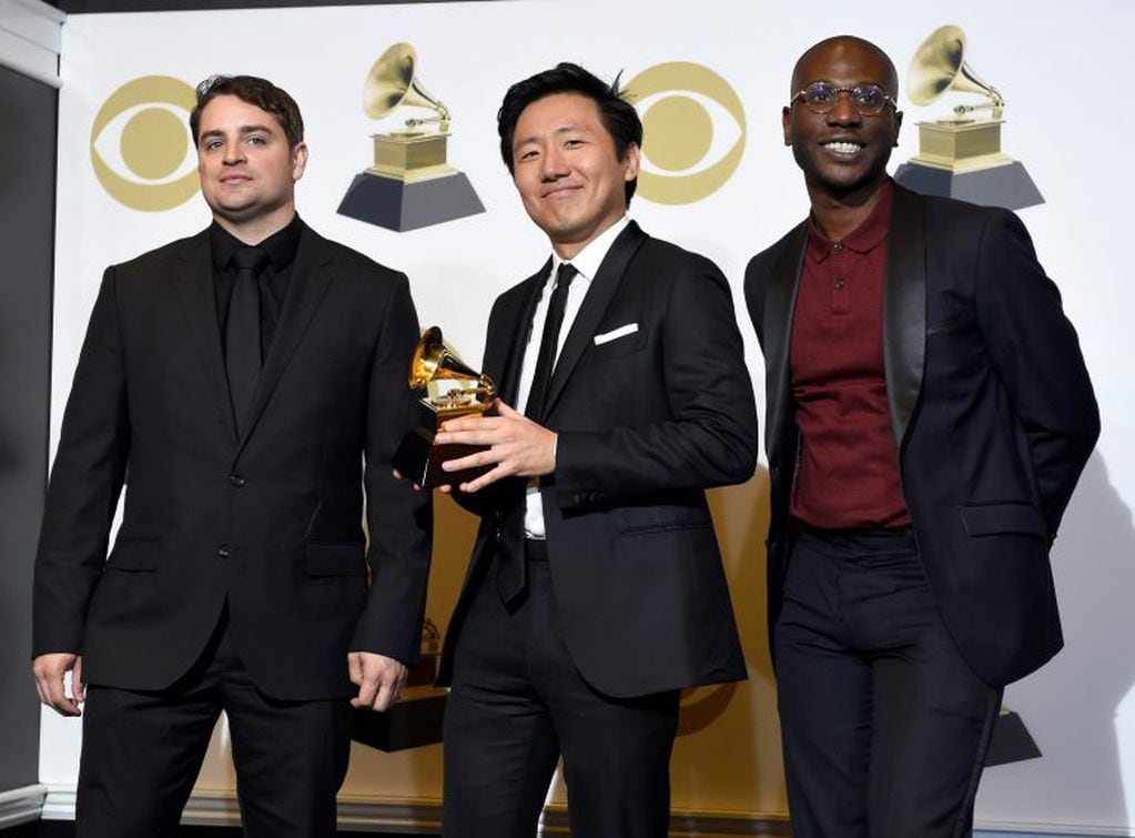 Jason Cole, from left, Hiro Murai and Ibra Ake pose in the press room with the award for best music video for Childish Gambino's "This Is America" at the 61st annual Grammy Awards at the Staples Center on Sunday, Feb. 10, 2019, in Los Angeles. (Photo by Chris Pizzello/Invision/AP)