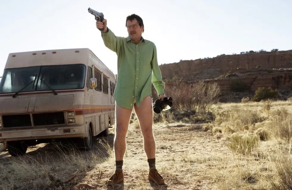This image released by AMC shows Walter White, played by Bryan Cranston, next to the Winnebago he uses as a mobile meth lab in the pilot episode of \