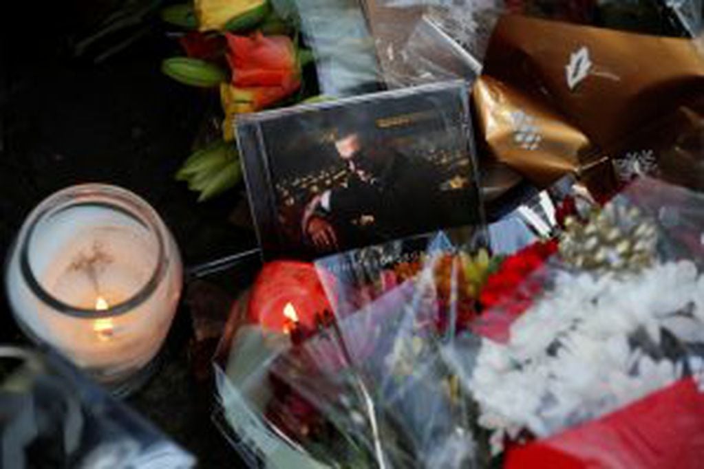 A music CD is left amongst tributes left outside the home of British musician George Michael in London, Monday, Dec. 26, 2016. George Michael, who rocketed to stardom with WHAM! and went on to enjoy a long and celebrated solo career lined with controversies, has died, his publicist said Sunday. He was 53. (AP Photo/Kirsty Wigglesworth)