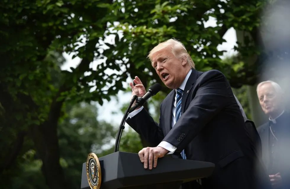 US President Donald Trump speaks before signing an u201cExecutive Order on Promoting Free Speech and Religious Libertyu201d in the Rose Garden of the White House on May 4, 2017 in Washington, DC.nTrump issued an executive order on Thursday making it easier for churches and religious groups to take part in politics without risk of losing their tax-exempt status, a senior White House official said. / AFP PHOTO / MANDEL NGAN