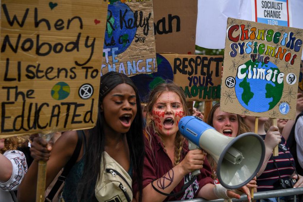Student climate activists hold banners and shout slogans during a Fridays for Future event near the Houses of Parliament in London, U.K., on Friday, May 24, 2019. On a day when teenagers across the world again mobilized against climate inaction, the movement's icon, Swedish activist Greta Thunberg, said the continent's policy makers -- including environmentalists -- are all failing to heed the climate crisis. Photographer: Chris J. Ratcliffe/Bloomberg