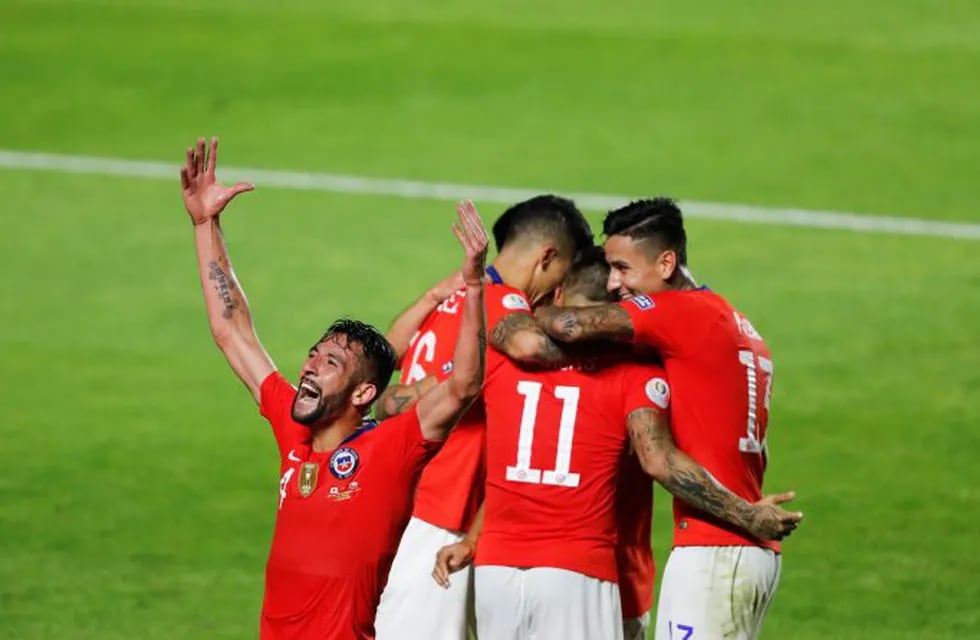 Chile's Mauricio Isla, left, celebrates after Chile's Eduardo Vargas scored his side's 4th goal during a Copa America Group C soccer match against Japan at the Morumbi stadium in Sao Paulo, Brazil, Monday, June 17, 2019. (AP Photo/Nelson Antoine)